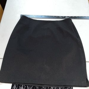 Guess size 10 black mini  skirt above the knee with sheen like new